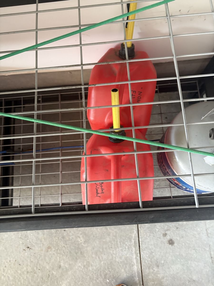 Pair of Plastic Gas Cans with Spouts