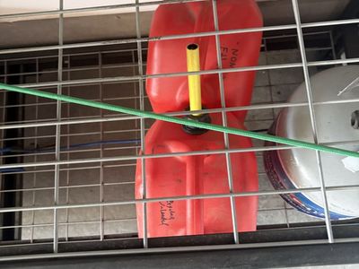 Pair of Plastic Gas Cans with Spouts