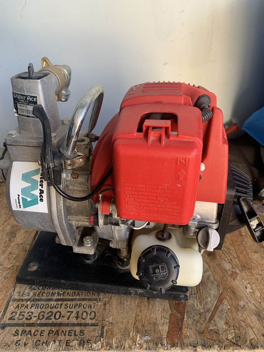 Gas powered portable water pump on Honda motor,perfect condition.