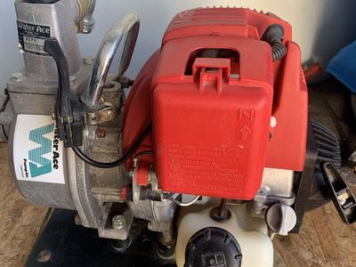 Gas powered portable water pump on Honda motor,perfect condition.