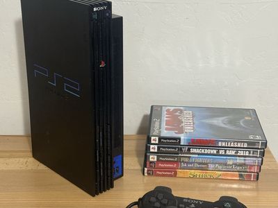 PlayStation 2 with one controller and 5 games