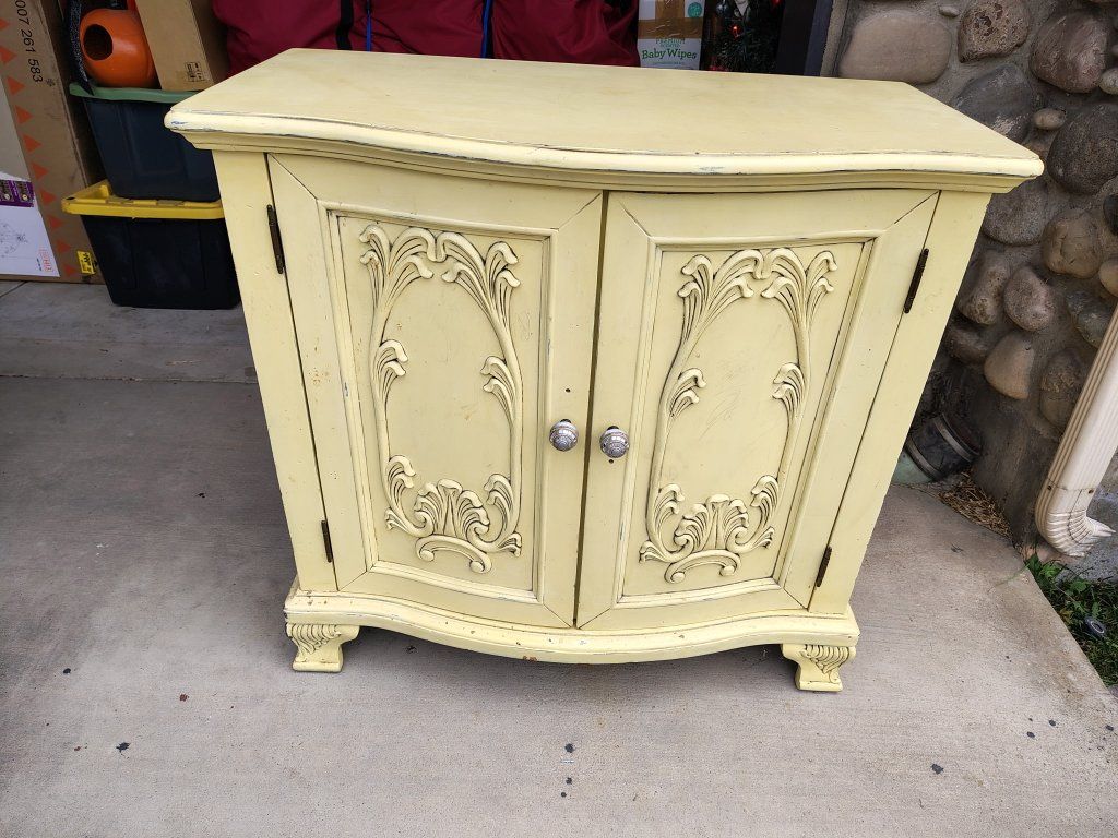 Vintage Yellow Painted Wooden Cabinet with Carved Accent Doors & Interior Shelf