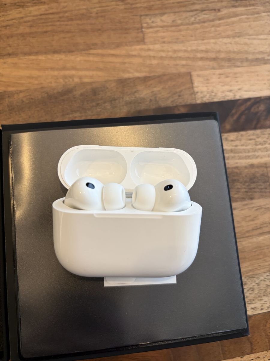 AirPods Pro 3, with DBrand case