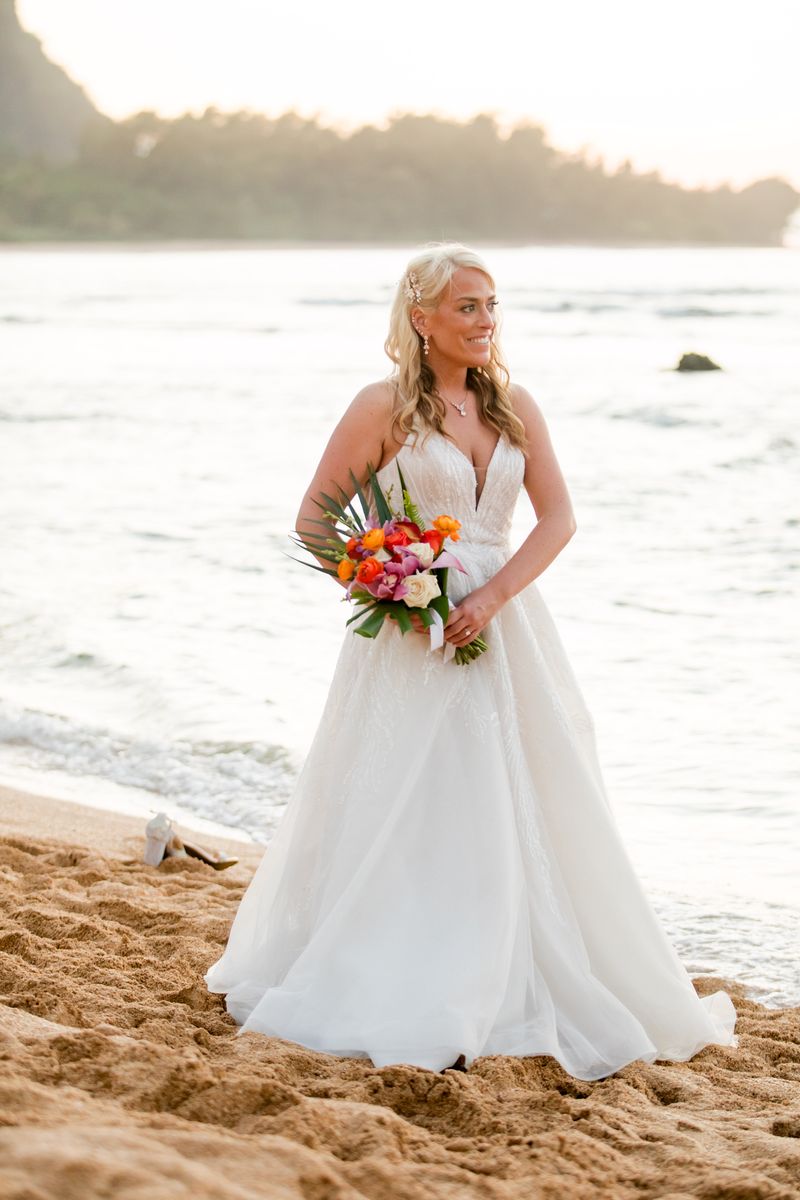 Georgeous designer wedding dress with detailed beading, train, and to the floor, in length wedding gown