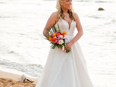 Georgeous designer wedding dress with detailed beading, train, and to the floor, in length wedding gown