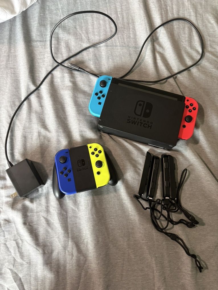 Nintendo Switch + 4 Joy Con Controllers