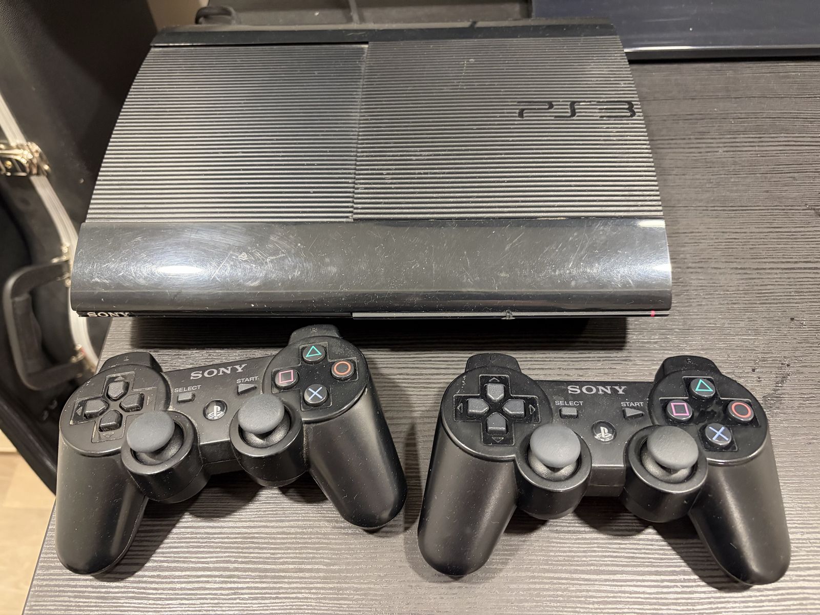Sony PlayStation 3 PS3 Super Slim Console with 2 Controllers & Charging Cable
