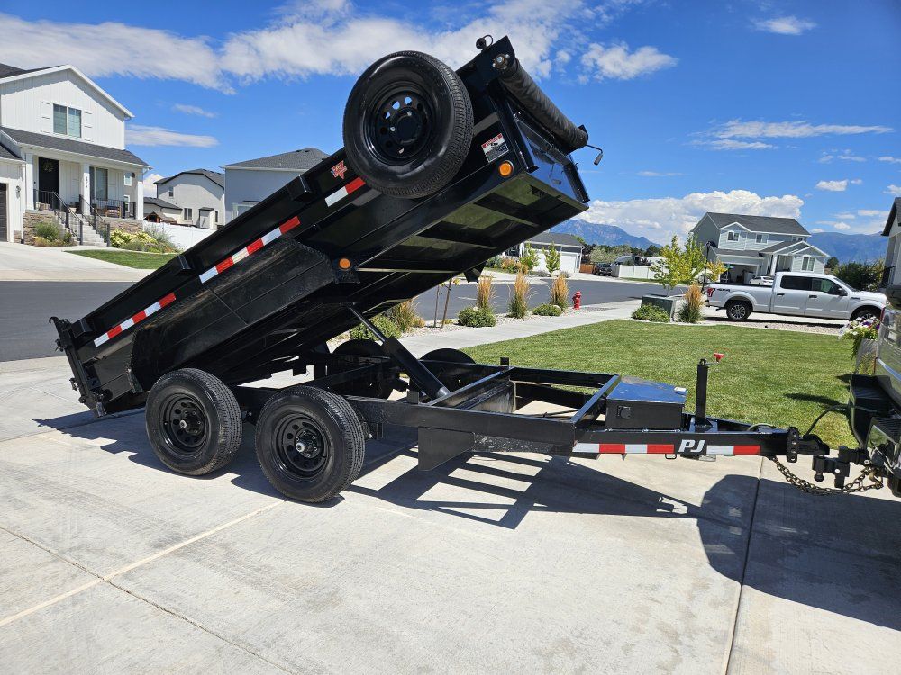 2024 12x7 PJ Trailers Black Dump Trailer with Hydraulic Lift and Spare Tire