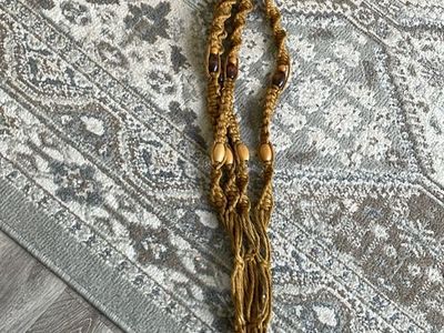 Vintage boho-style mustard yellow/tan jute or coarse fiber macrame plant hanger wooden beads