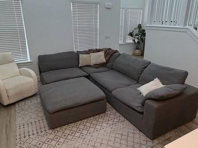 Spacious Grey Modular Sectional Sofa with Ottoman - Customizable Layout, Excellent Condition