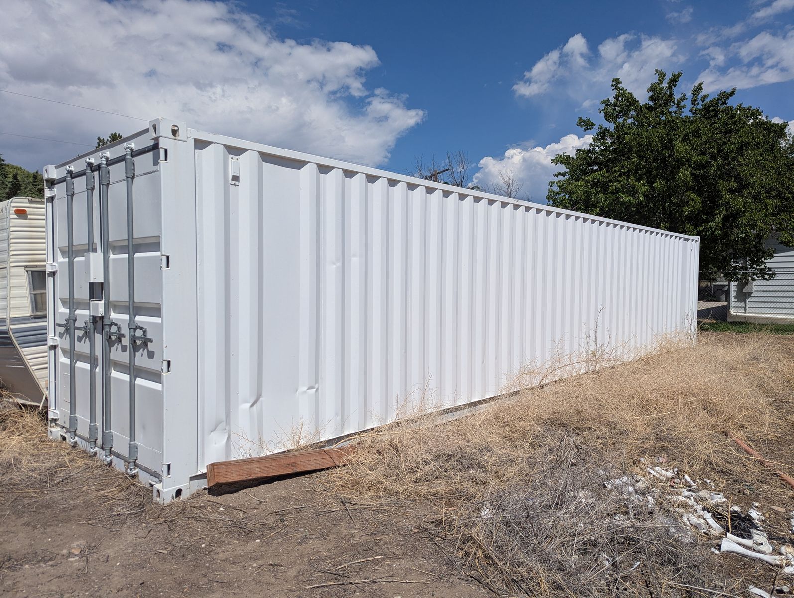 40' White Shipping Container with Electrical Outlet & Overhead Lighting
