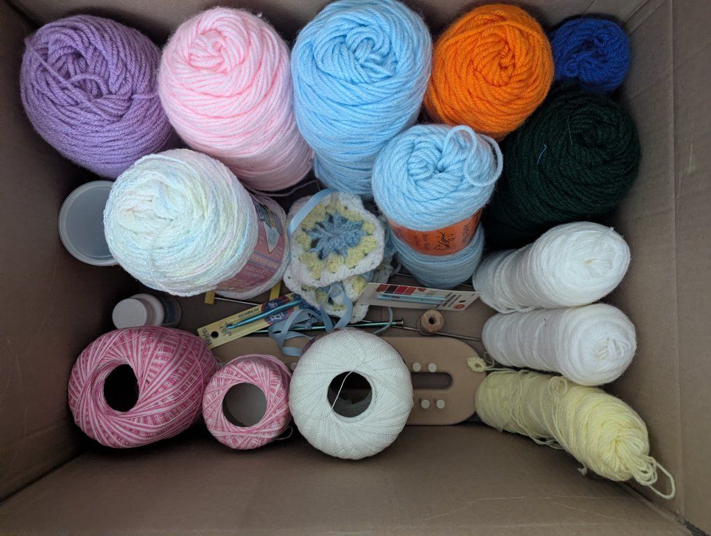Lot of yarn and crochet hooks