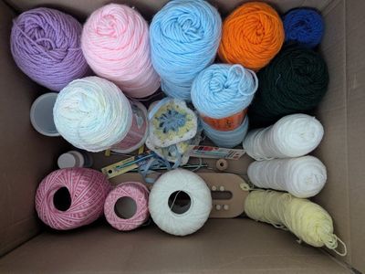 Lot of yarn and crochet hooks
