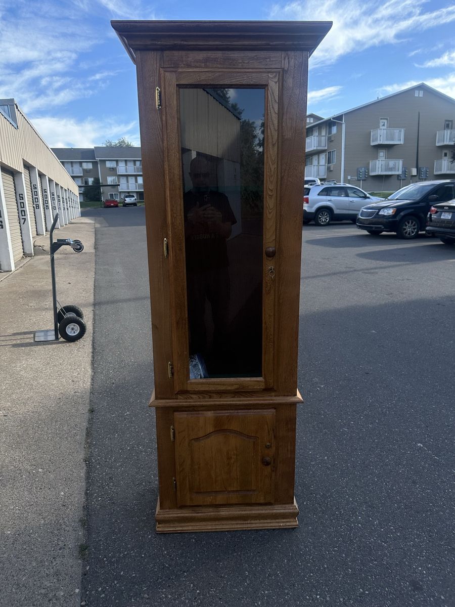 Six Rifle Wood Cabinet with Locking Glass Door and Locking Storage.