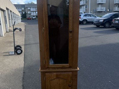 Six Rifle Wood Cabinet with Locking Glass Door and Locking Storage.