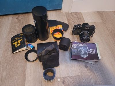 Canon F1 old film camera with lenses.
