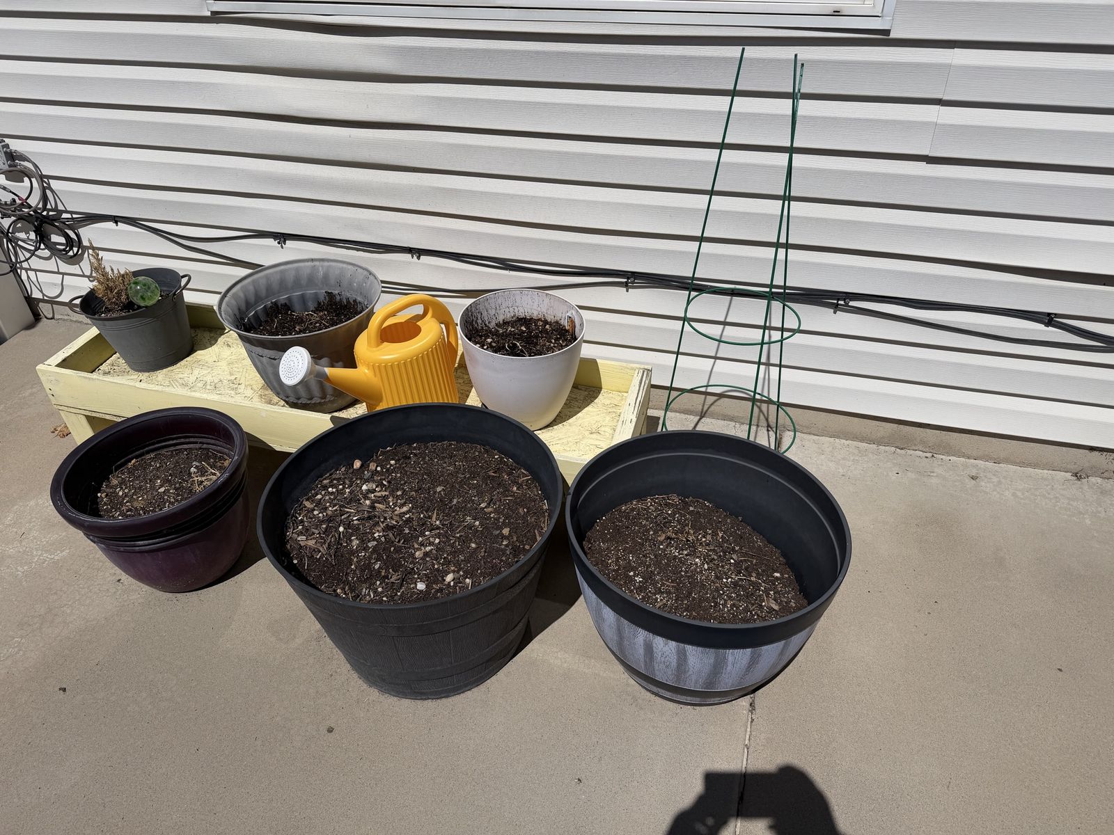 6 planters and a stand
