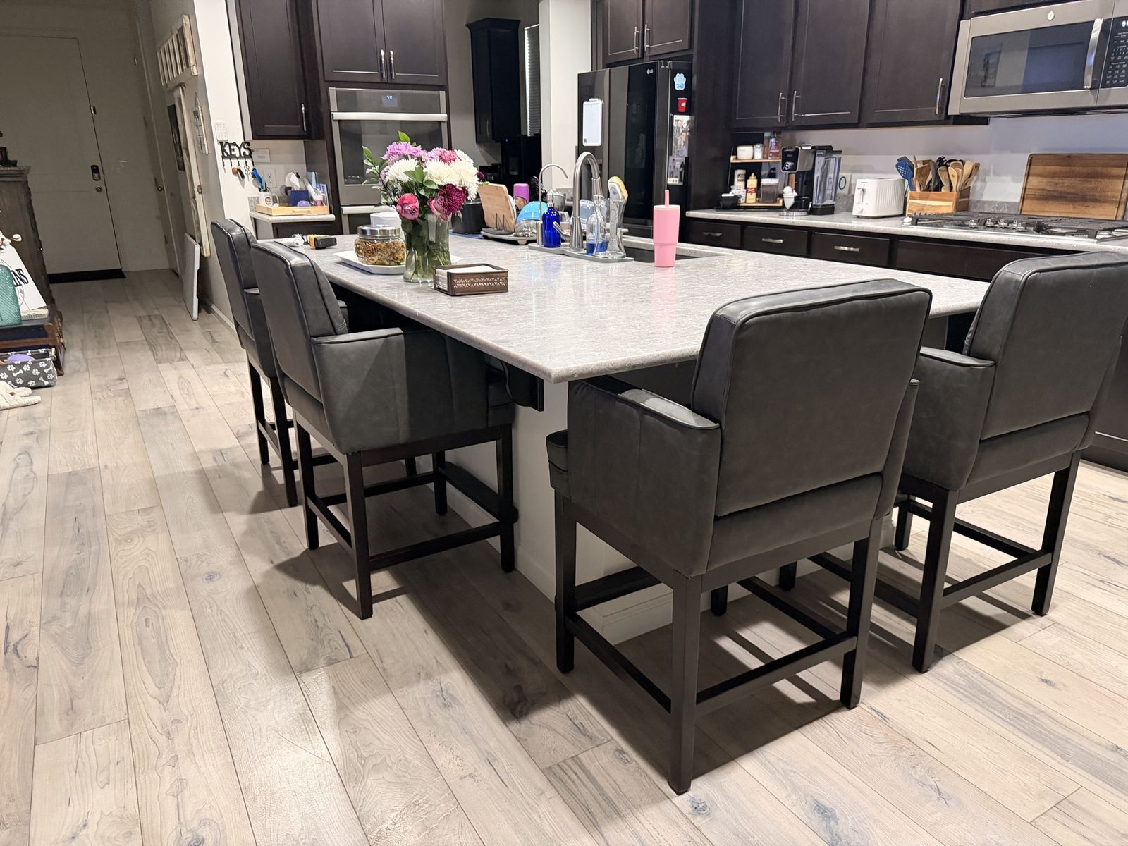 LUE BONA 27 in. Black Gray Faux Leather Counter Height Bar Stool with Armrests and Wood Frame, Set of 4