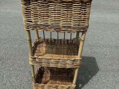 three-tier wicker or rattan basket shelf