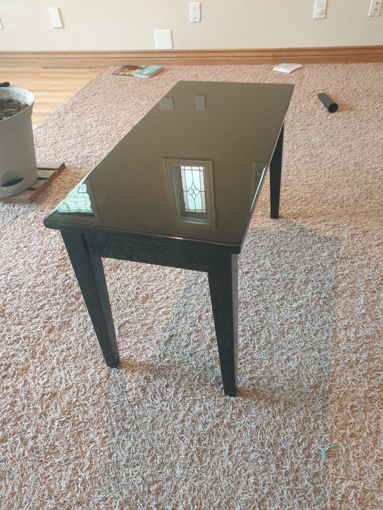 Black piano bench