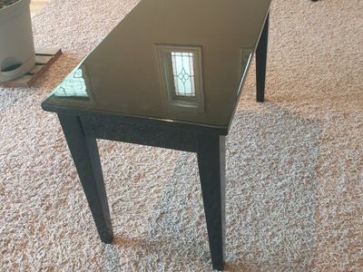 Black piano bench