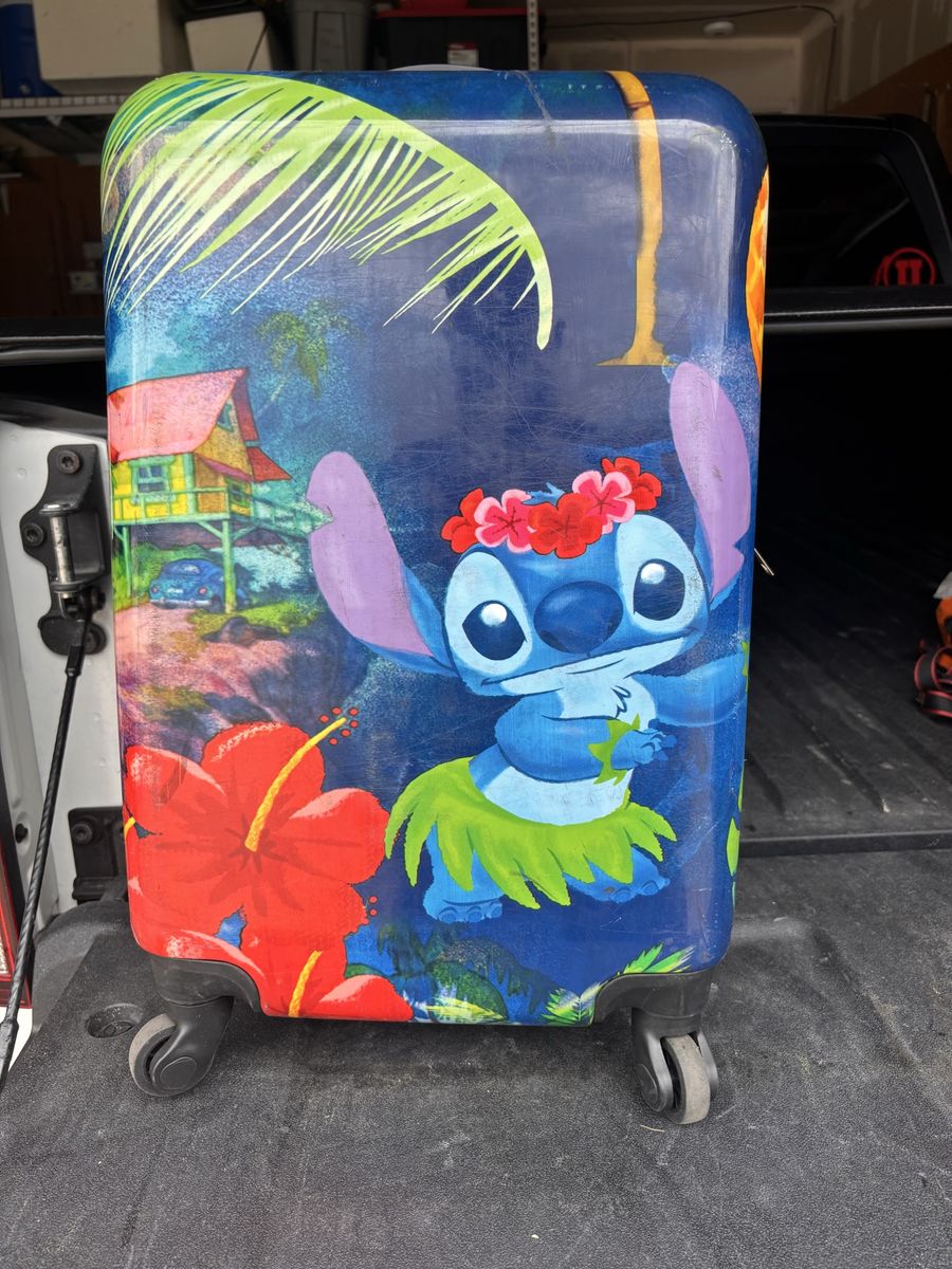 Nice medium sized rolling suitcase (stitch) in great condition