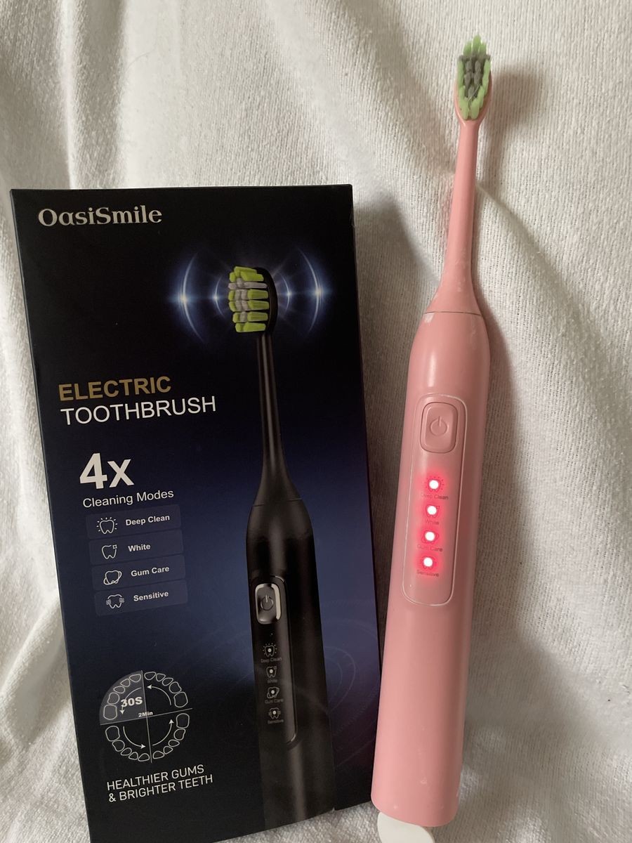 Electric tooth brush 5 brand new heads goes with lot