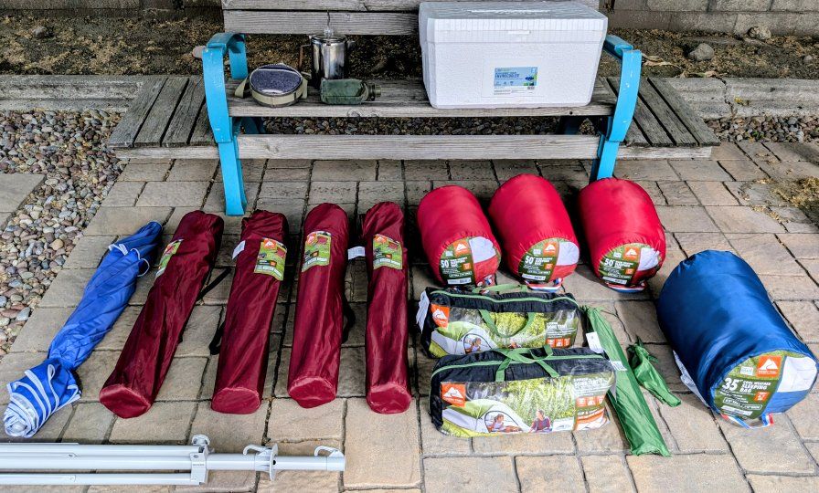 Camping Supplies! Shade umbrella, tents, sleeping bags, cooler, 12 cup coffee percolator, etc. All New or used just once.