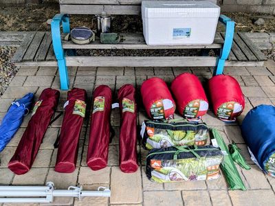 Camping Supplies! Shade umbrella, tents, sleeping bags, cooler, 12 cup coffee percolator, etc. All New or used just once.