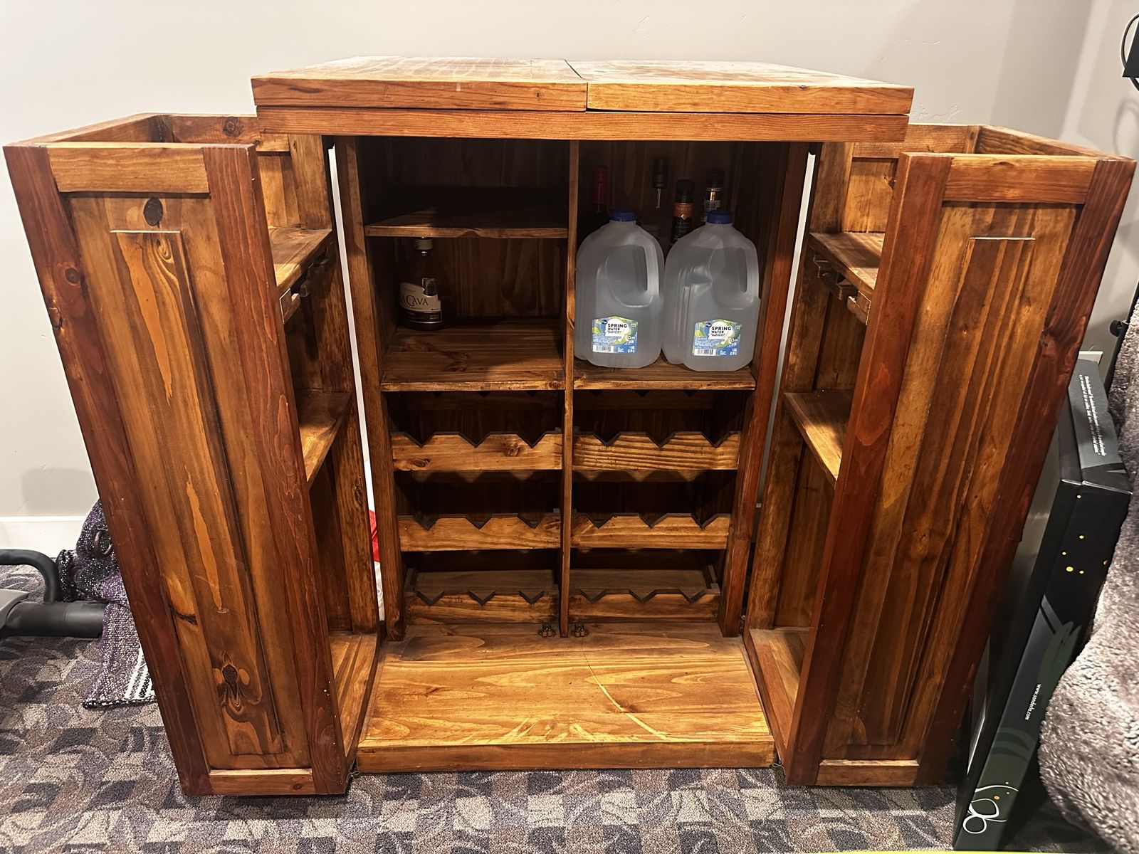 Rustic Wooden Bar Cabinet with Wine Storage and Fold-Out Doors
