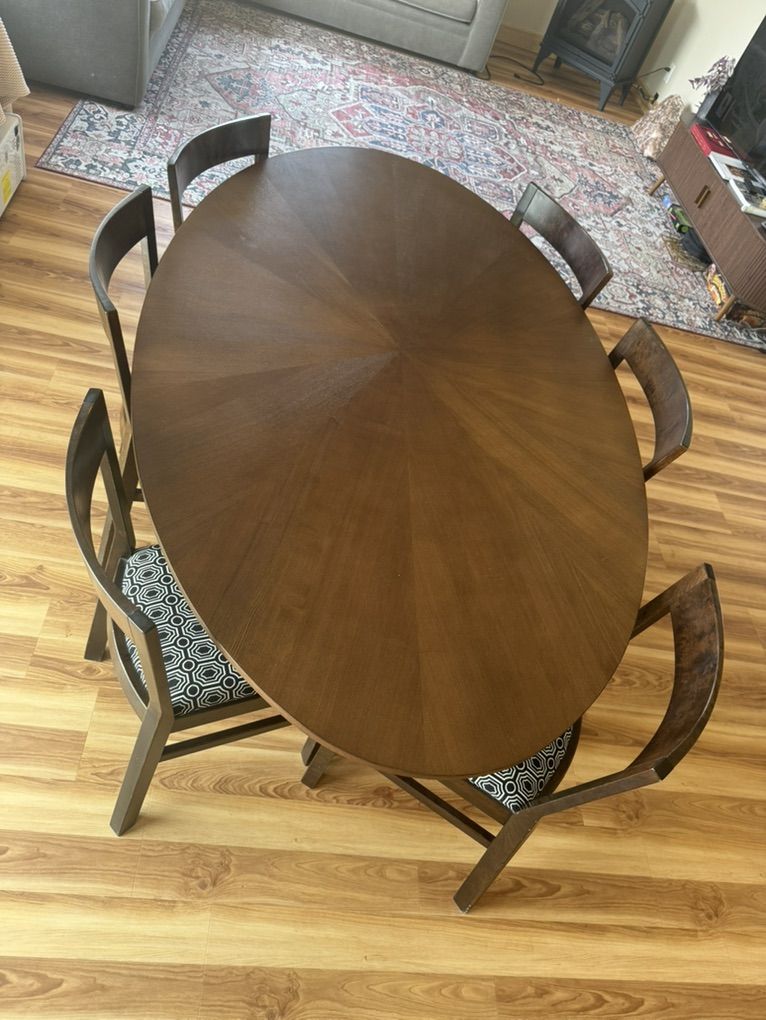 74” OVAL DINING TABLE & 6 CHAIRS — $600