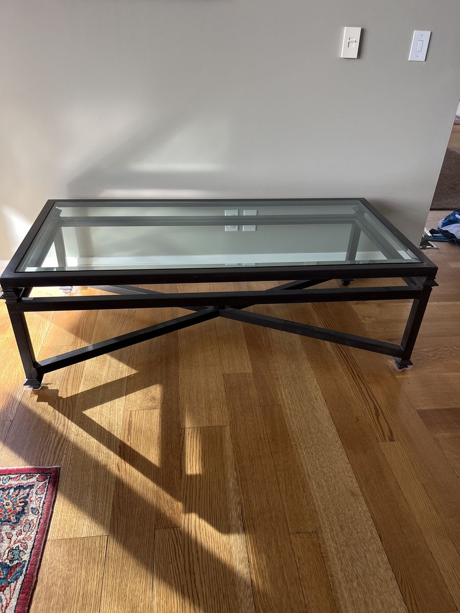 Beautiful Kreiss Collection iron and beveled glass coffee table. Same table still on luxury website