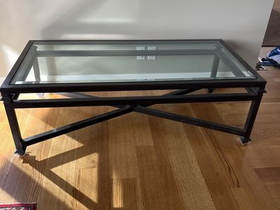 Beautiful Kreiss Collection iron and beveled glass coffee table. Same table still on luxury website