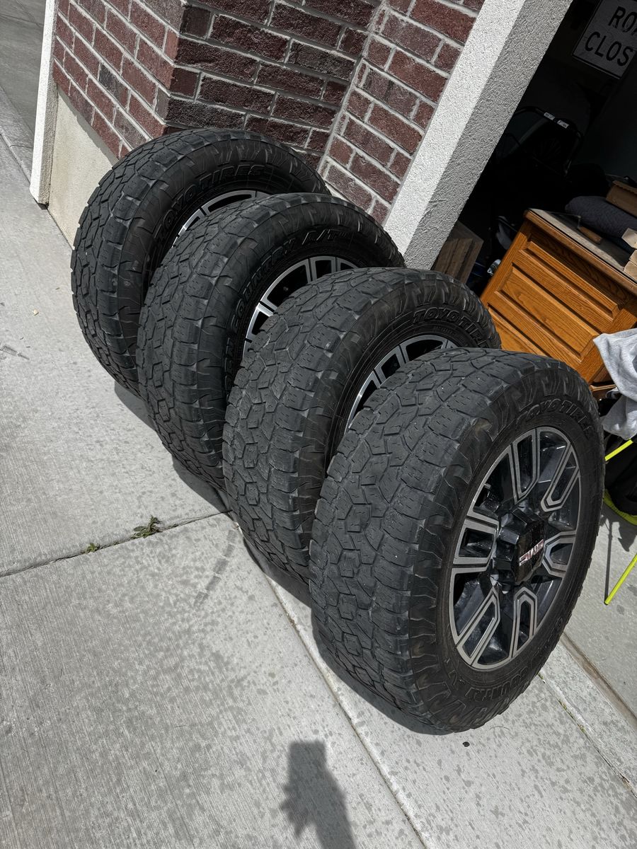 20” GMC stock rims 8x180 with Toyo tires