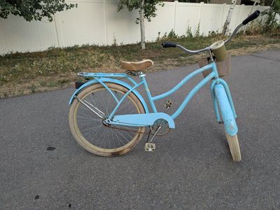 Light Blue Bicycle with Basket and Rear Rack