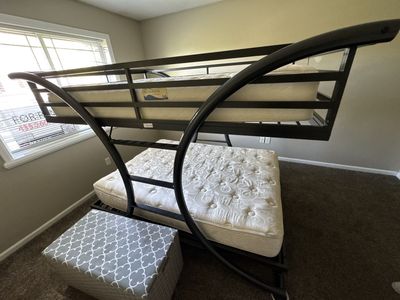 Full over full metal bunk bed with mattresses