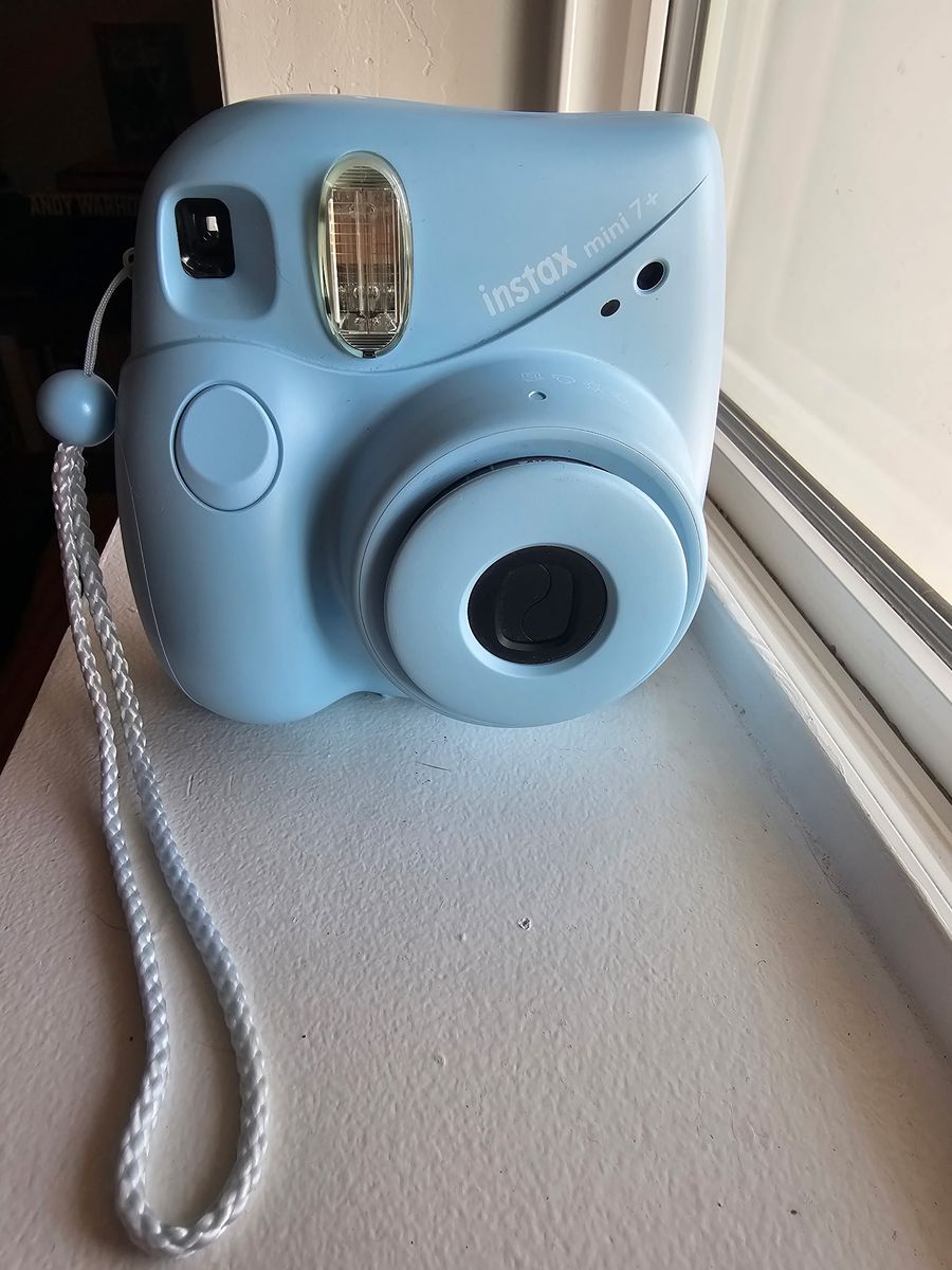 Blue Fuji film camera with film