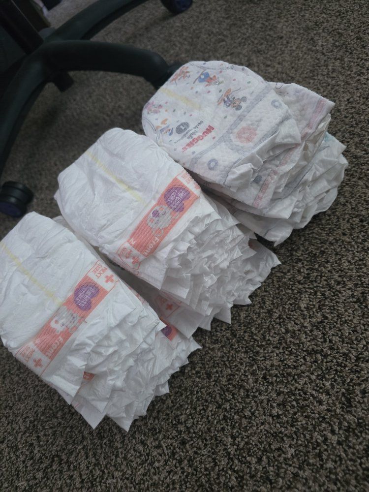 Free size 1 and 2 diapers / toys