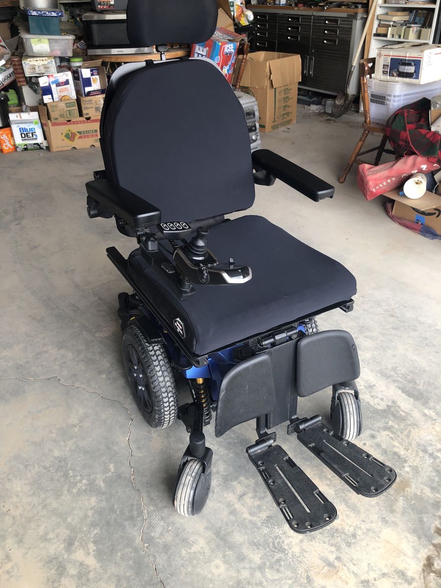 Quantum Edge 3 tilt mobile wheel chair and Braun chair lift