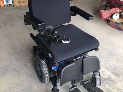Quantum Edge 3 tilt mobile wheel chair and Braun chair lift