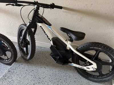 Stacyc 18” bike + batteries and charger