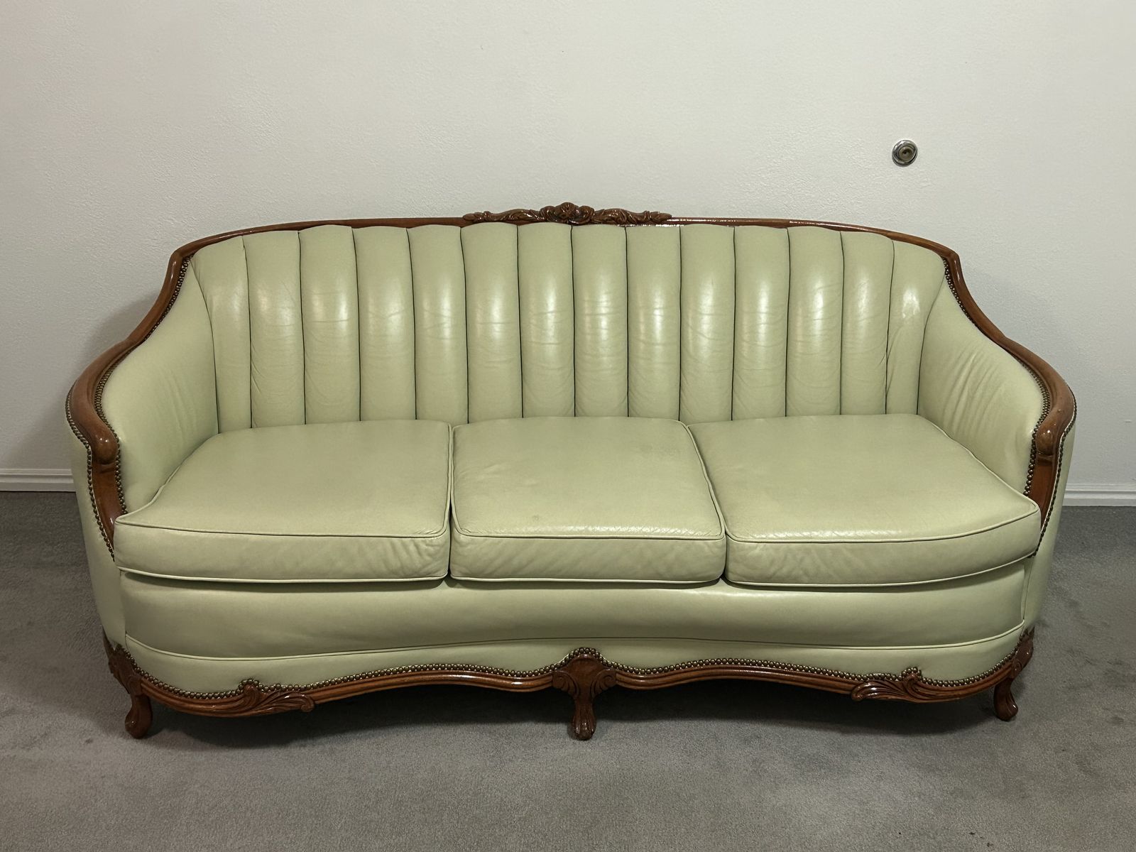 Vintage carved wood sofa
