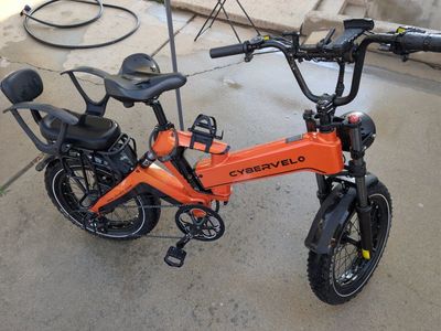 CyberVelo Electric Bike - Orange E-Bike with Child Seat & Fat Tires
