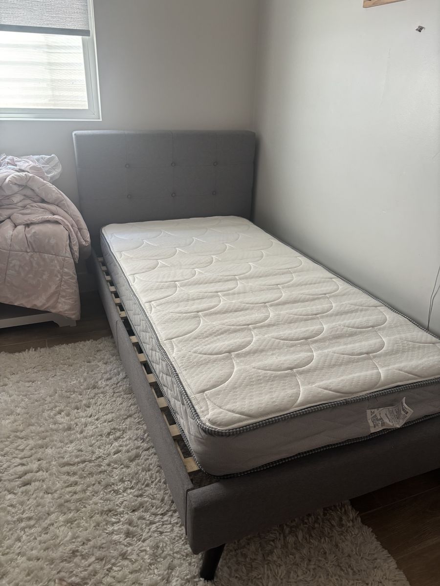Twin size bed, mattress, comforter and sham, and side table