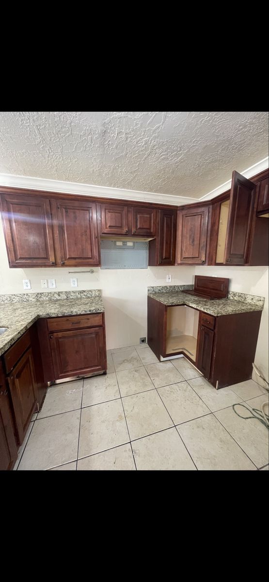 Used cabinets for sale, knotty  older with Cherrywood stain check pictures, They need cleaning does not come with granite.