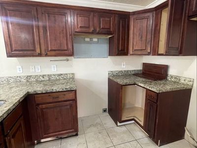 Used cabinets for sale, knotty older with Cherrywood stain check pictures, They need cleaning does not come with granite.