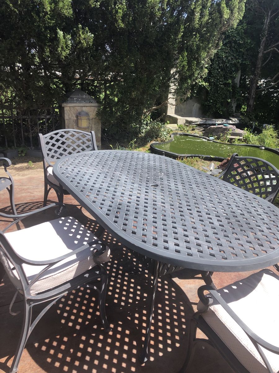 Oasis Oval Patio Dining Set: Table & 5 Chairs w/ Cushions & Covers