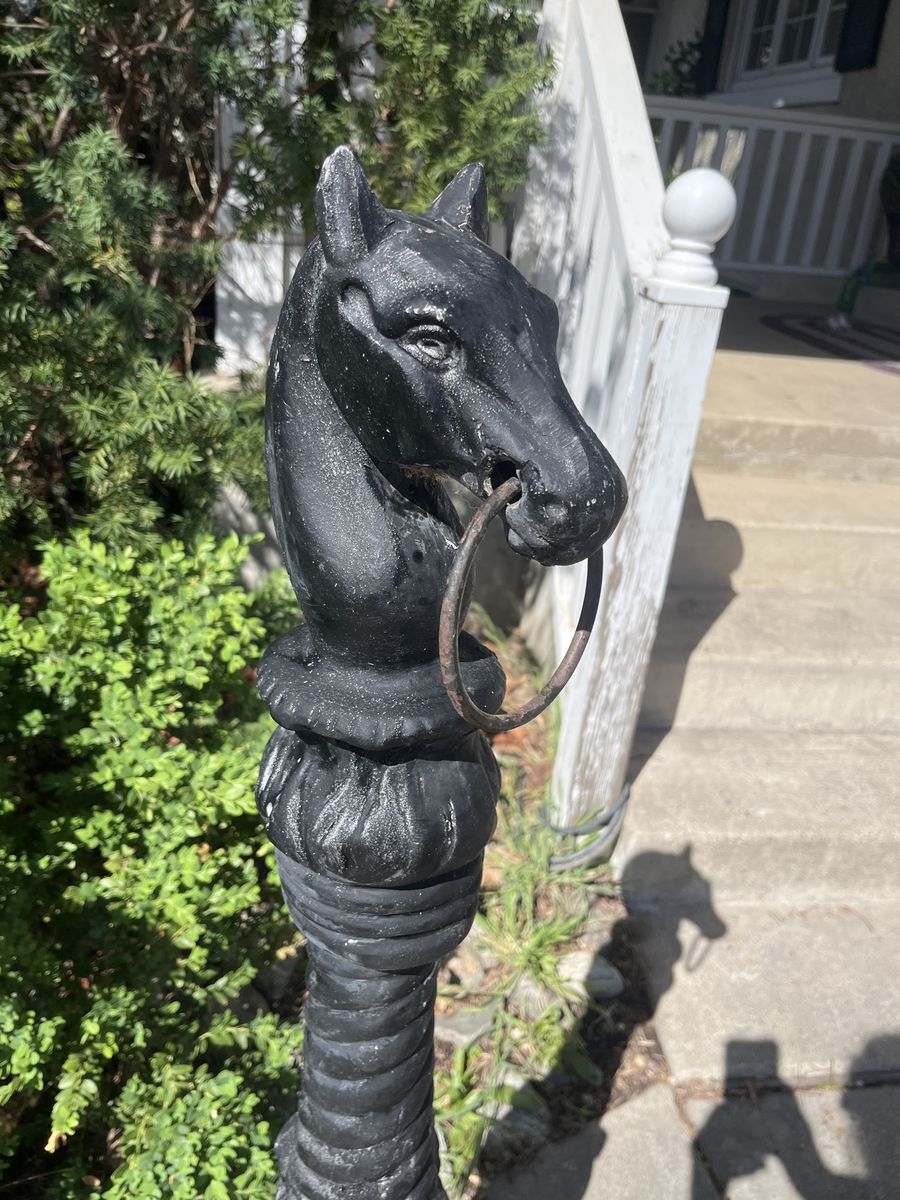 Antique horse head hitching post