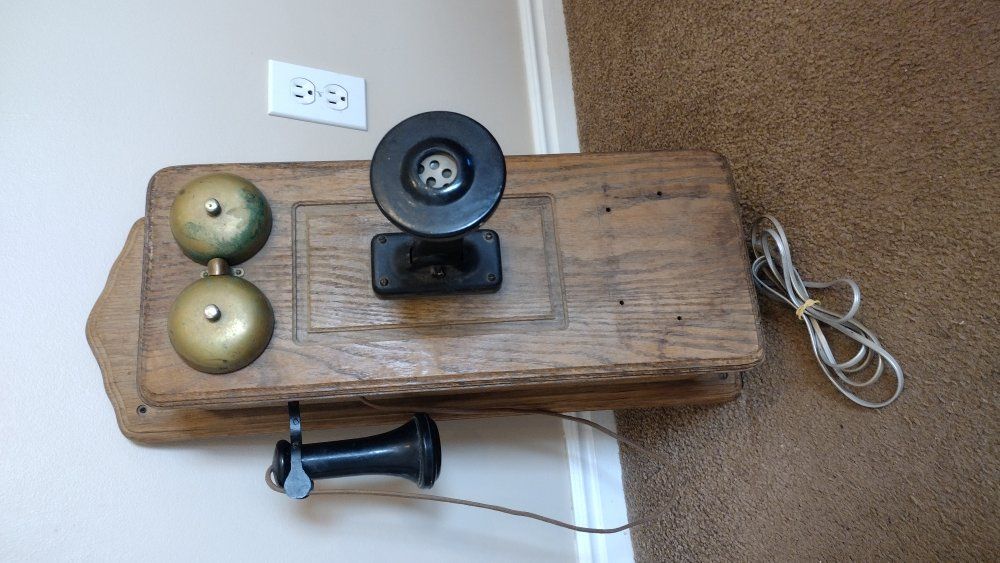 working vintage wood wall rotary phone