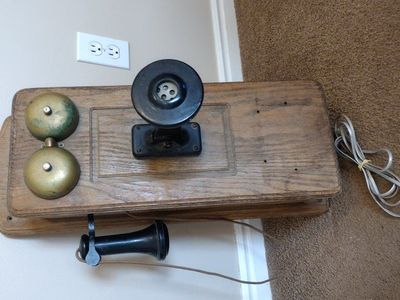 working vintage wood wall rotary phone